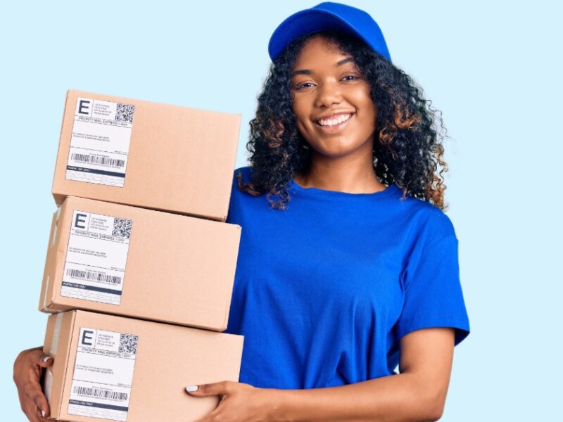 a woman holding boxes for delivery